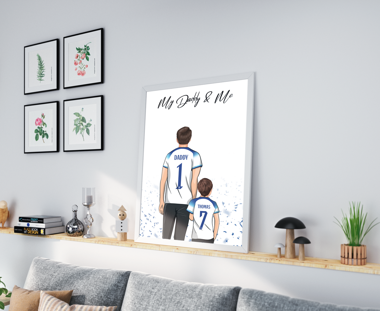 Personalised Father's Day picture featuring a father and child wearing their favorite football shirts. The child is happily perched on the father's shoulders. The football shirts display custom names and numbers, adding a personal touch to the picture. The vibrant colors and attention to detail highlight the love and bond between the father and child, as well as their shared passion for football. This heartwarming picture captures a special moment that will be treasured for years to come.