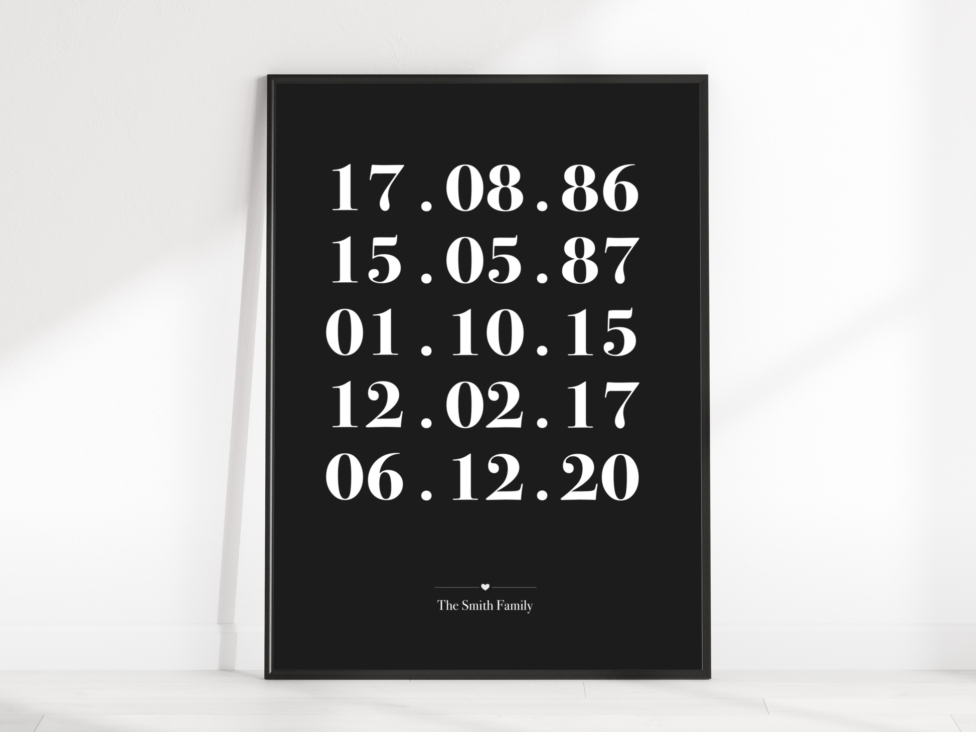 A beautifully framed Personalised Family Dates Print displayed on a wall. The print showcases a clean and minimalist design with customisable dates representing significant milestones. It serves as a heartfelt reminder of cherished memories and makes an ideal gift for weddings, housewarmings, or as a stylish addition to any family home.