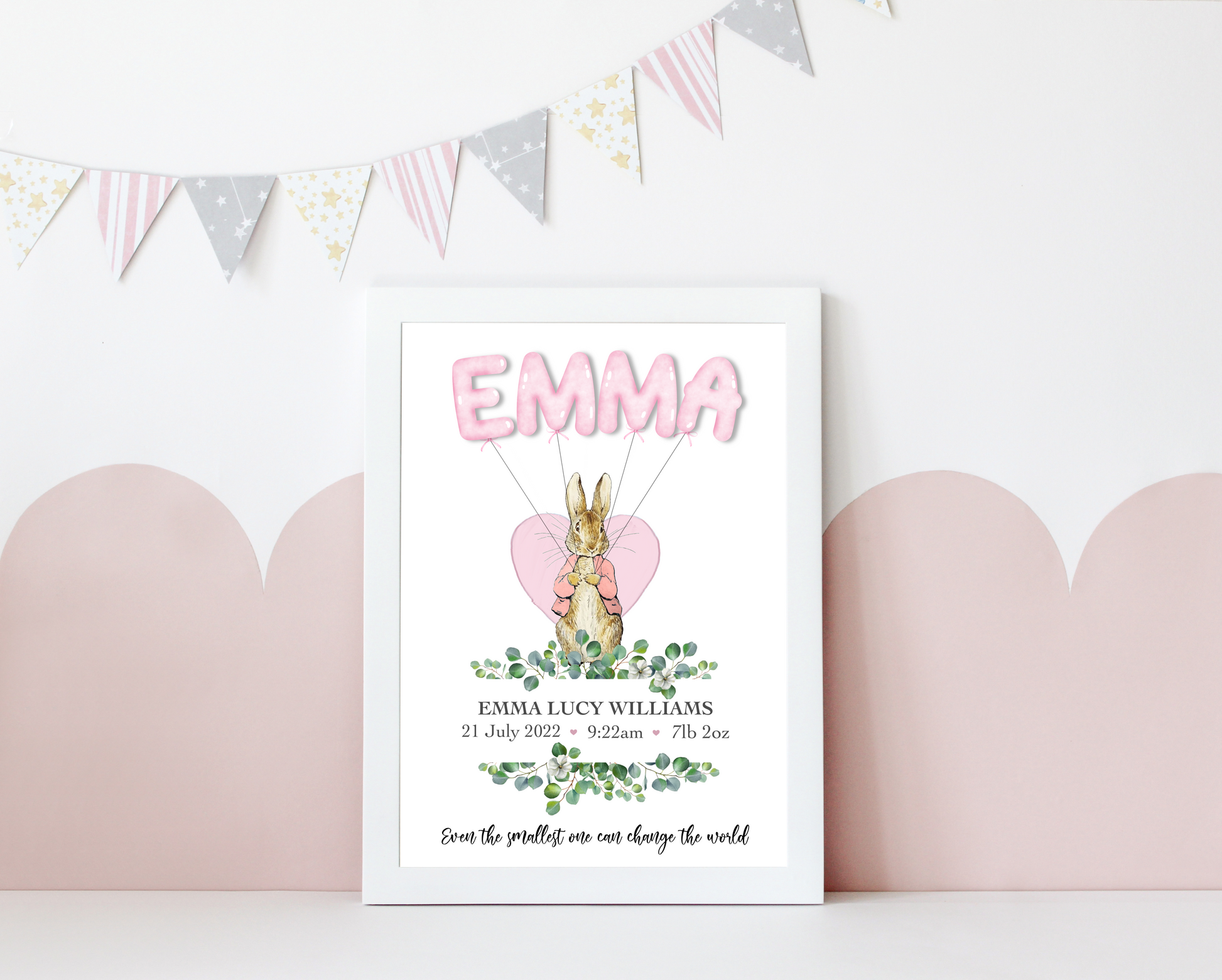 An enchanting home decor baby print featuring a cute rabbit holding colourful balloons that spell out the baby's name. A perfect personalised gift to celebrate a baby shower, baby birth, or christening. Capture the joy and create lasting memories with this delightful piece.