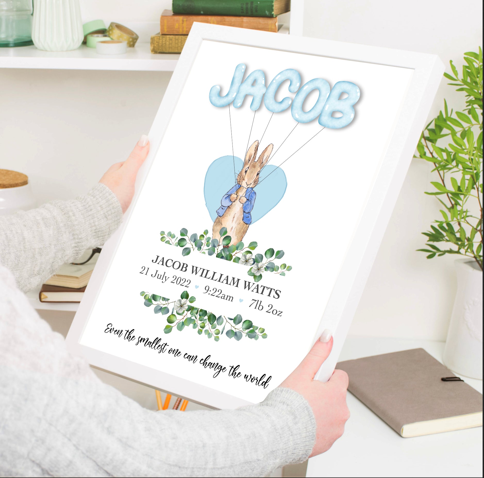 An enchanting home decor baby print featuring a cute rabbit holding colourful balloons that spell out the baby's name. A perfect personalised gift to celebrate a baby shower, baby birth, or christening. Capture the joy and create lasting memories with this delightful piece.