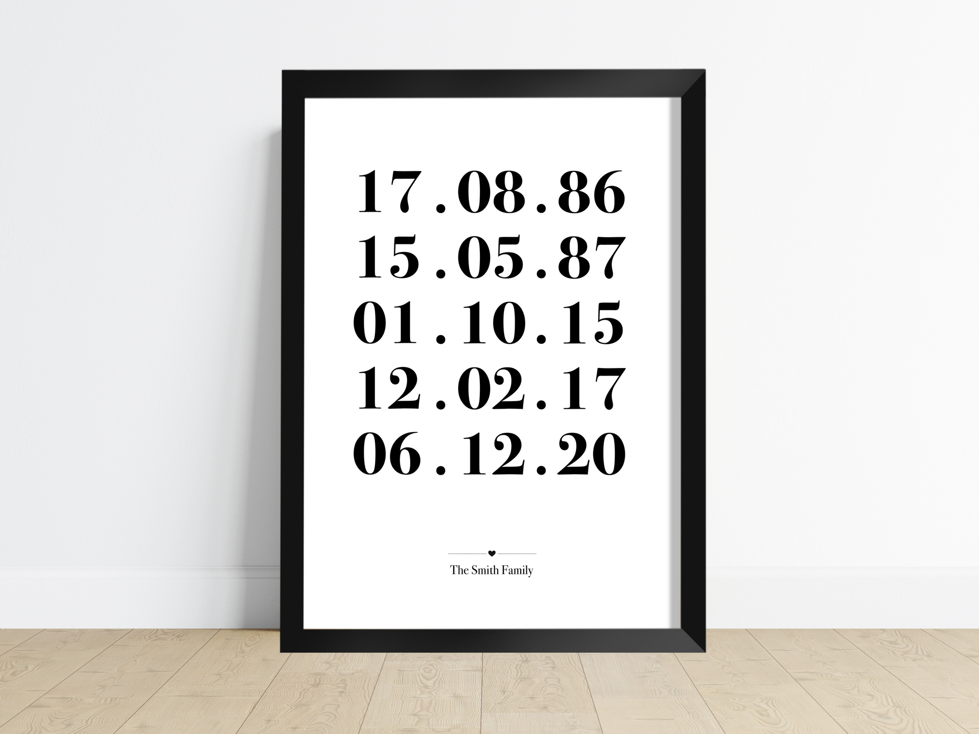 A beautifully framed Personalised Family Dates Print displayed on a wall. The print showcases a clean and minimalist design with customisable dates representing significant milestones. It serves as a heartfelt reminder of cherished memories and makes an ideal gift for weddings, housewarmings, or as a stylish addition to any family home.