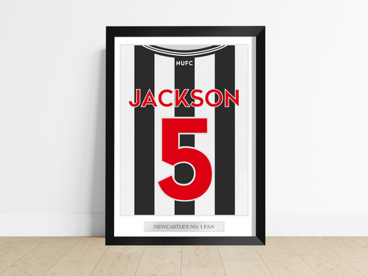 A personalised sports jersey back print hung on a wall in a tastefully decorated room, proudly featuring the team colours and custom name and number. Ideal for enhancing the ambiance in a child's bedroom, man cave, or sports bar